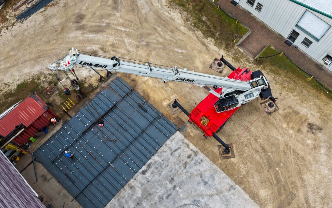 Aerial view of a Link-Belt 100|RT rough terrain crane lifting steelwork at St Johns Shipbuilding in Florida