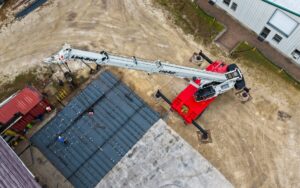 Aerial view of a Link-Belt 100|RT rough terrain crane lifting steelwork at St Johns Shipbuilding in Florida
