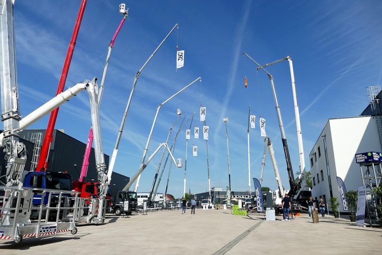 Böcker truck cranes and trailer cranes lined up with booms raised at the 360° Höhentage in Werne