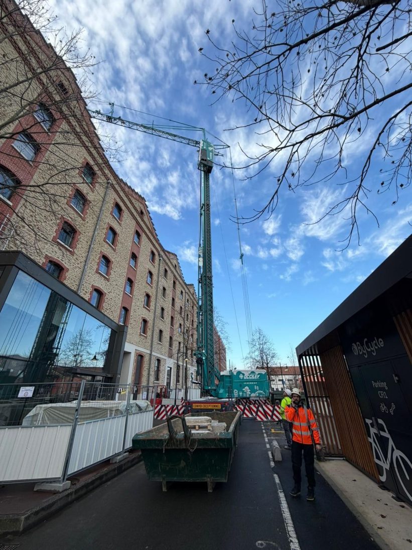 Spierings City Boy mobile tower crane working on a restricted-access urban site in France