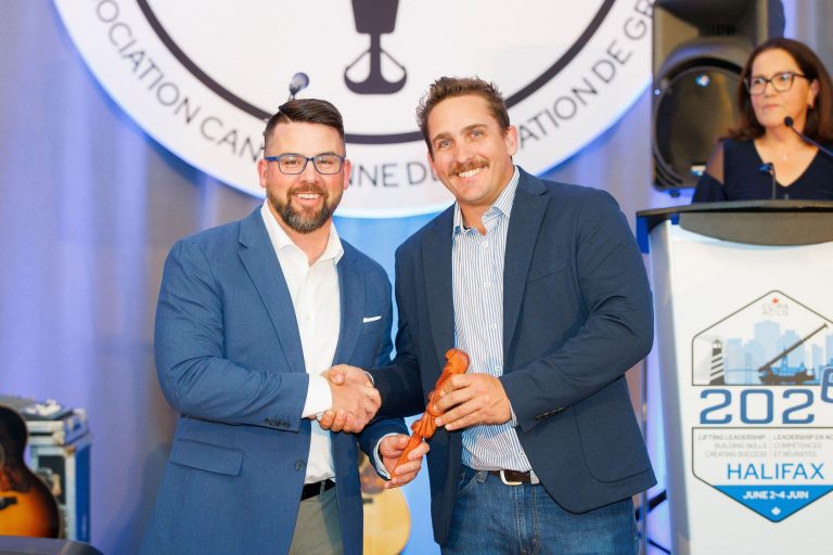 Justin Andrews of Tadano receiving the CCRA Talking Stick Award at the 2026 Canadian Crane Rental Association conference in Halifax
