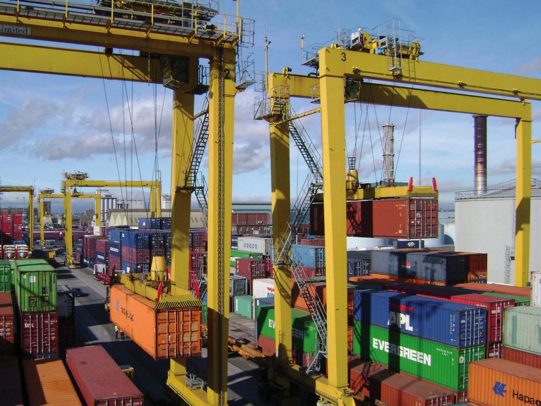 Liebherr rubber-tyred gantry cranes stacking containers at a port terminal