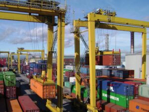 Liebherr rubber-tyred gantry cranes stacking containers at a port terminal