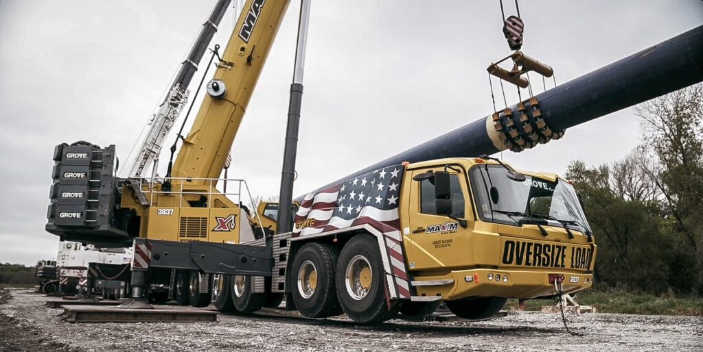All-terrain crane holding the water main during the Platte River trenchless pull