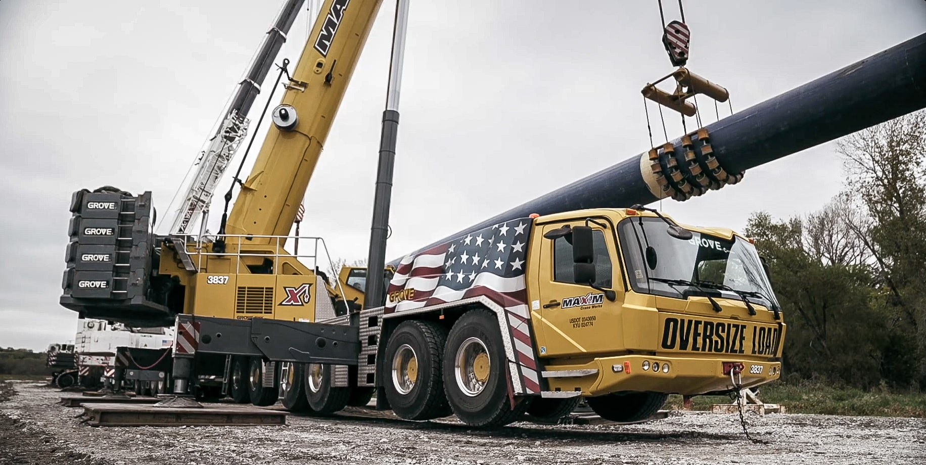 All-terrain crane holding the water main during the Platte River trenchless pull
