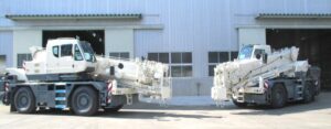 Two Kato CR-250RV CityRange cranes outside the Gunma plant before shipment to Europe