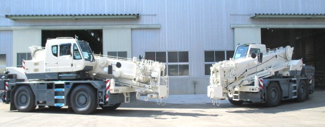 Two Kato CR-250RV CityRange cranes outside the Gunma plant before shipment to Europe