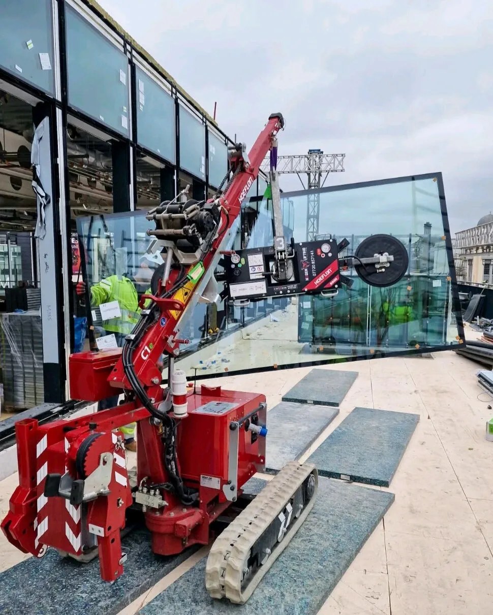 Hoeflon C1e mini crane working in a confined indoor space in England