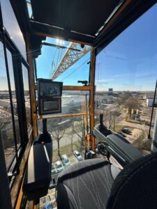 Renewed Spierings mobile tower crane cab mounted on the tower with the jib overhead
