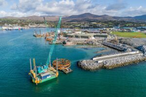 Aerial view of the Dinish Wharf expansion at Castletownbere with Kobelco crawler cranes on site