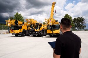 Liebherr Crane Finder app shown on a smartphone on a jobsite