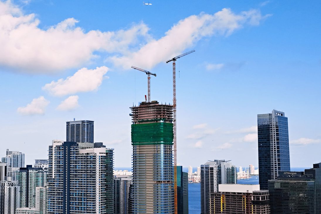 Liebherr tower cranes on high-rise construction sites in Miami
