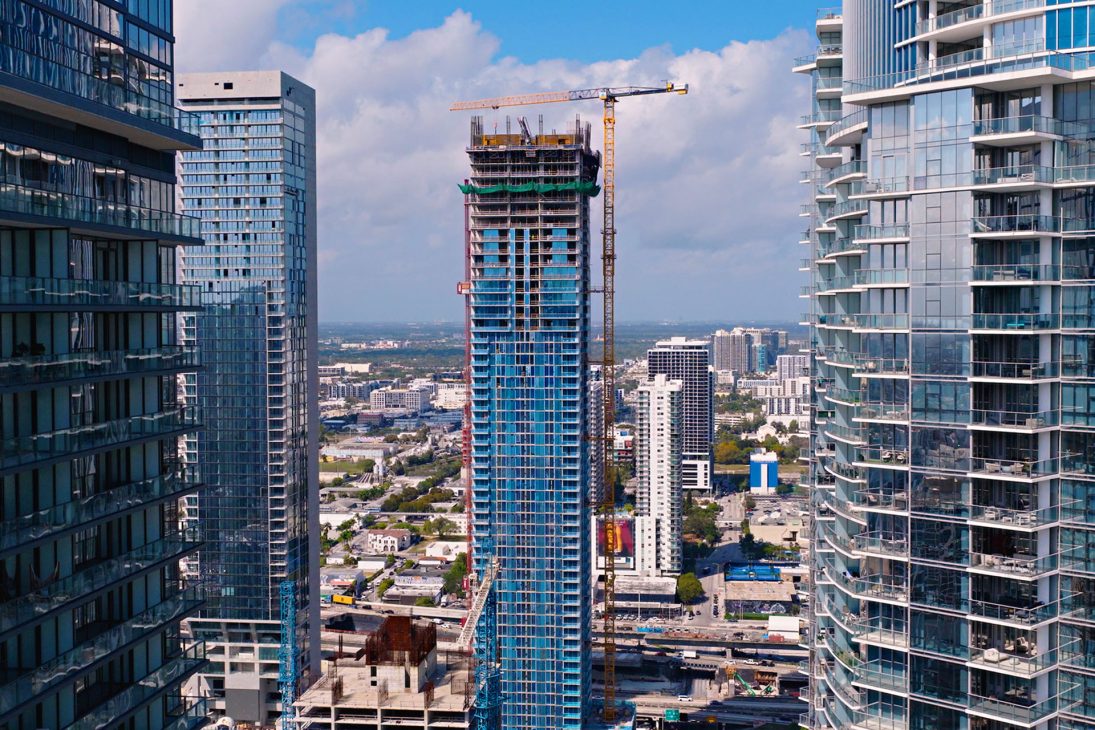 Liebherr tower cranes on high-rise construction sites in Miami