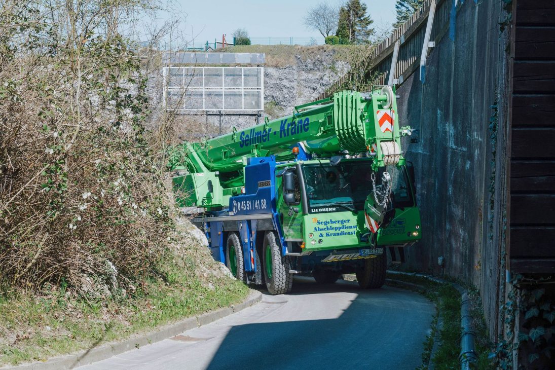 Scenery component being lifted into place by the Liebherr 90-tonne mobile crane