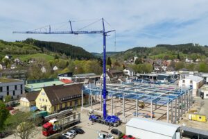 Liebherr MK 120-5.1E mobile construction crane placing roof sheeting at Lenzkirch