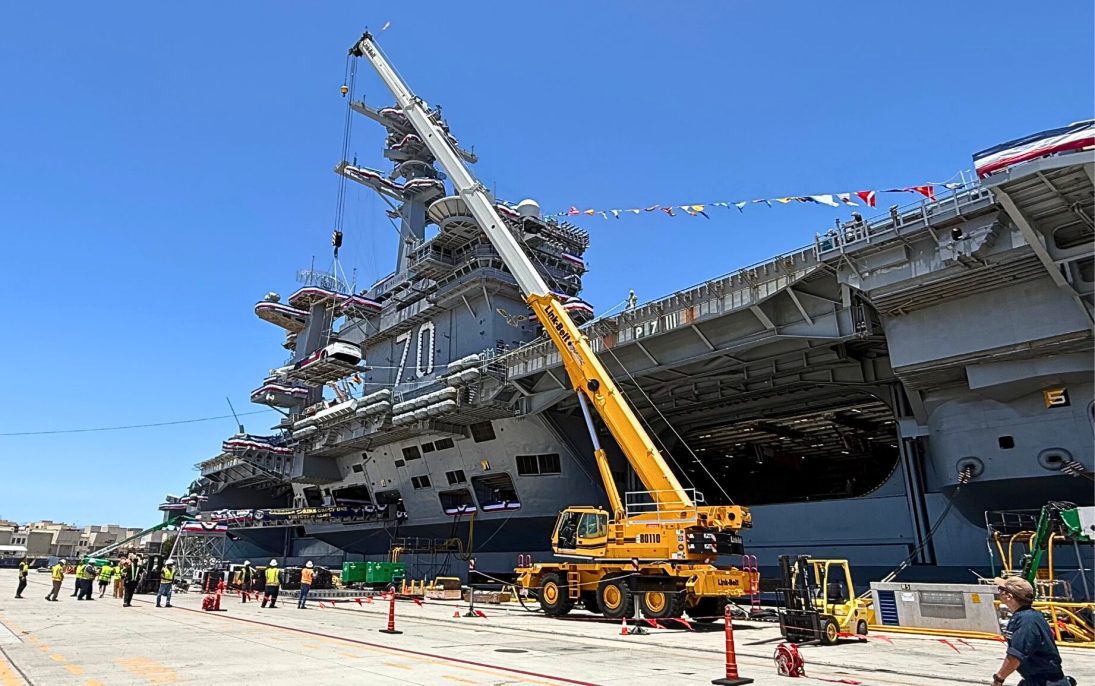 Link-Belt 110-ton rough terrain crane on the pier lifting over the flight deck of the USS Carl Vinson at Naval Base Coronado