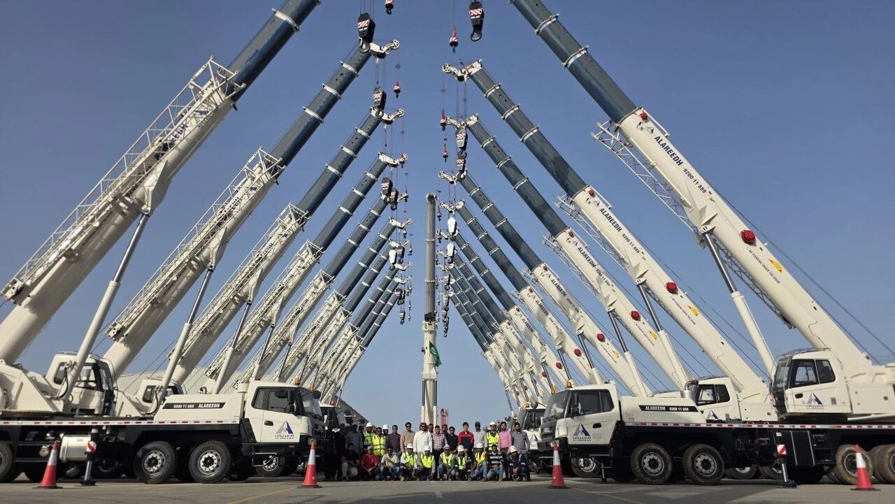 SANY 50-tonne truck cranes lined up with booms raised at the handover to Saudi rental company Mohammad Abdullah Al Areedh in Jubail
