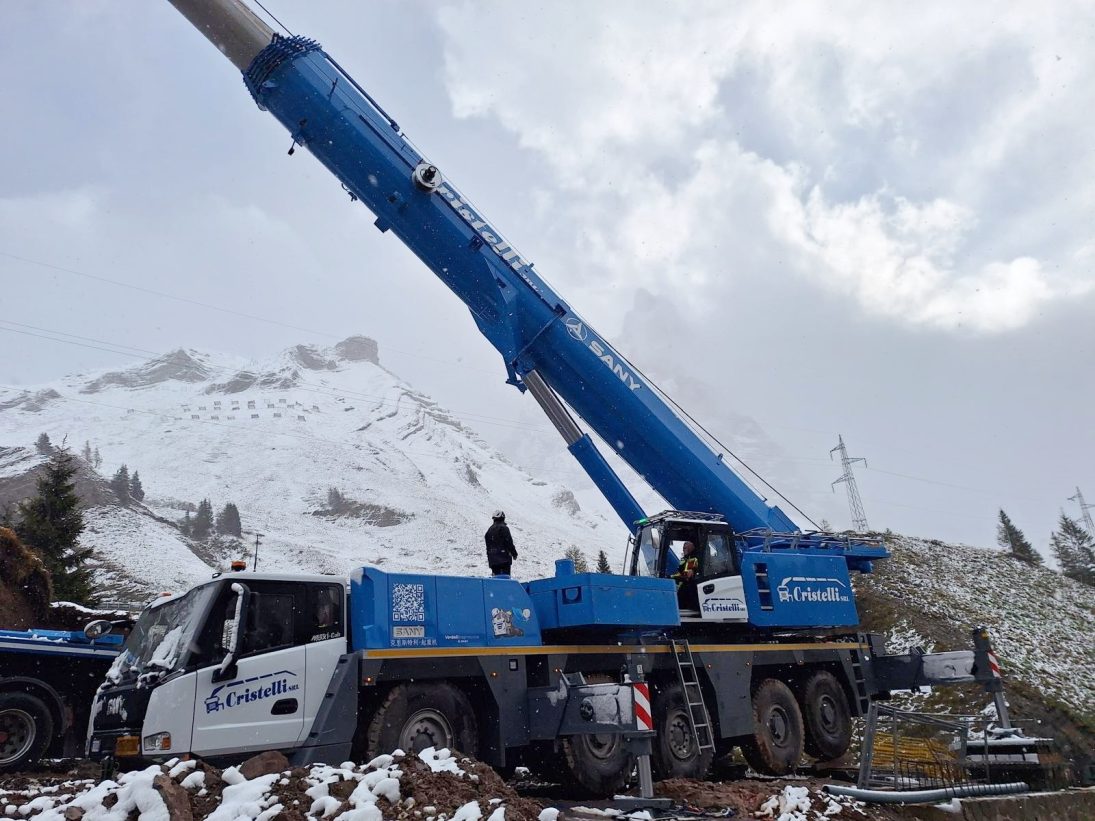 SANY SAC2500E all-terrain crane in Cristelli livery set up in the snow for the steel bridge span lift on the SS50 in the Italian Alps