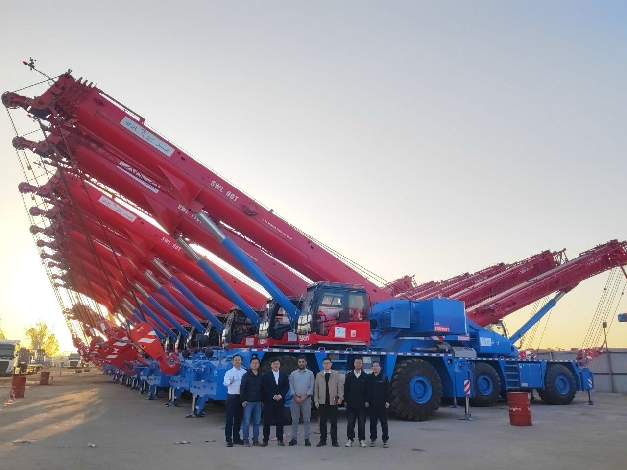 SANY rough terrain and all-terrain cranes lined up at handover to a Saudi rental company working on Aramco projects