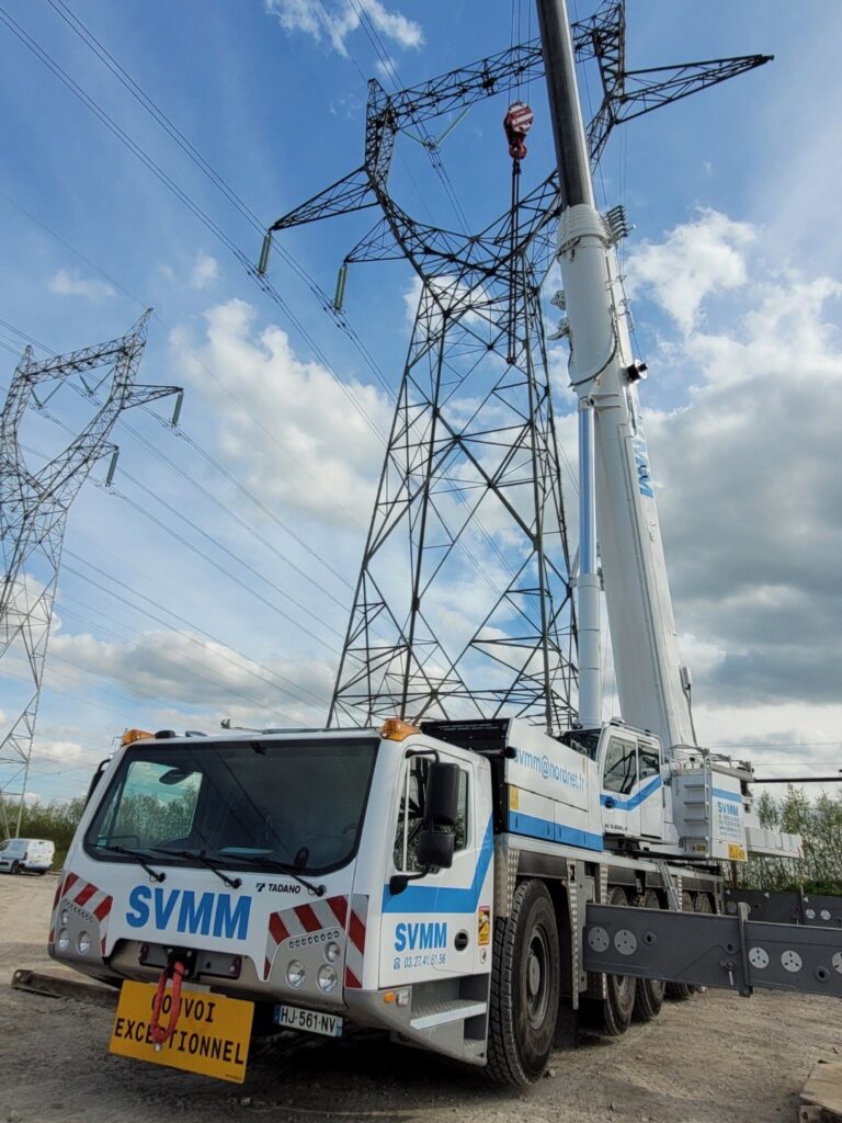 S.V.M.M.'s new Tadano AC 5.250L-2 all terrain crane rigged beside electricity pylons in northern France