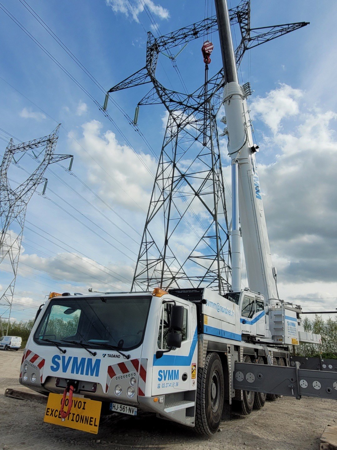 S.V.M.M.'s new Tadano AC 5.250L-2 all terrain crane rigged beside electricity pylons in northern France