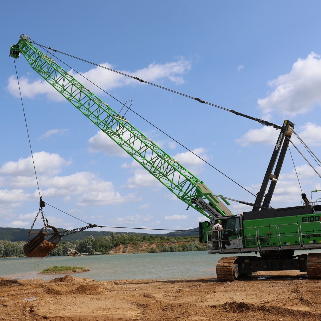 Sennebogen 6100 duty cycle crane on its crawler undercarriage in the gravel pit