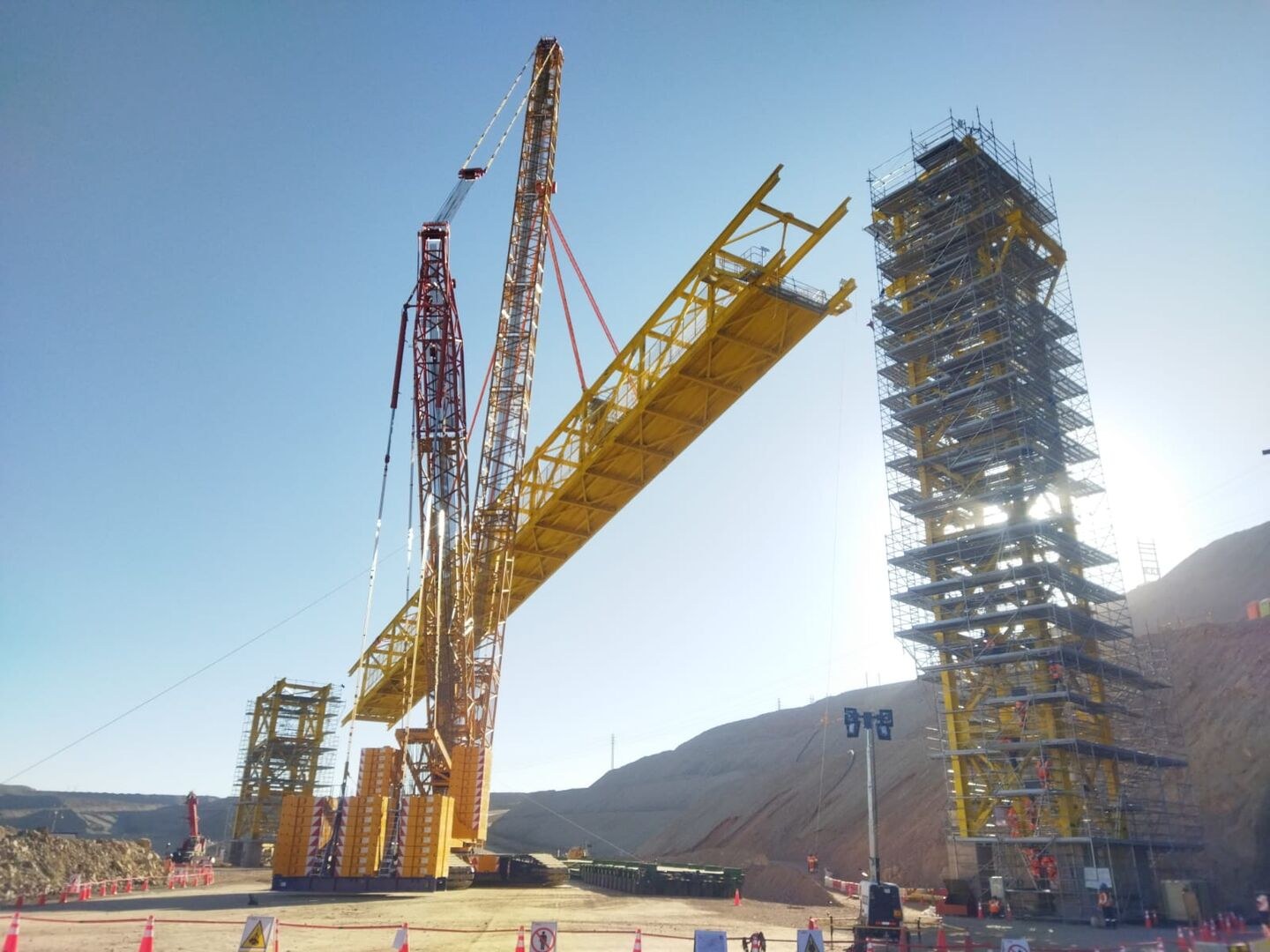 Tadano CC 38.650-1 lattice boom crawler crane lifting an 80-metre conveyor section at the Cerro Verde mine in Peru