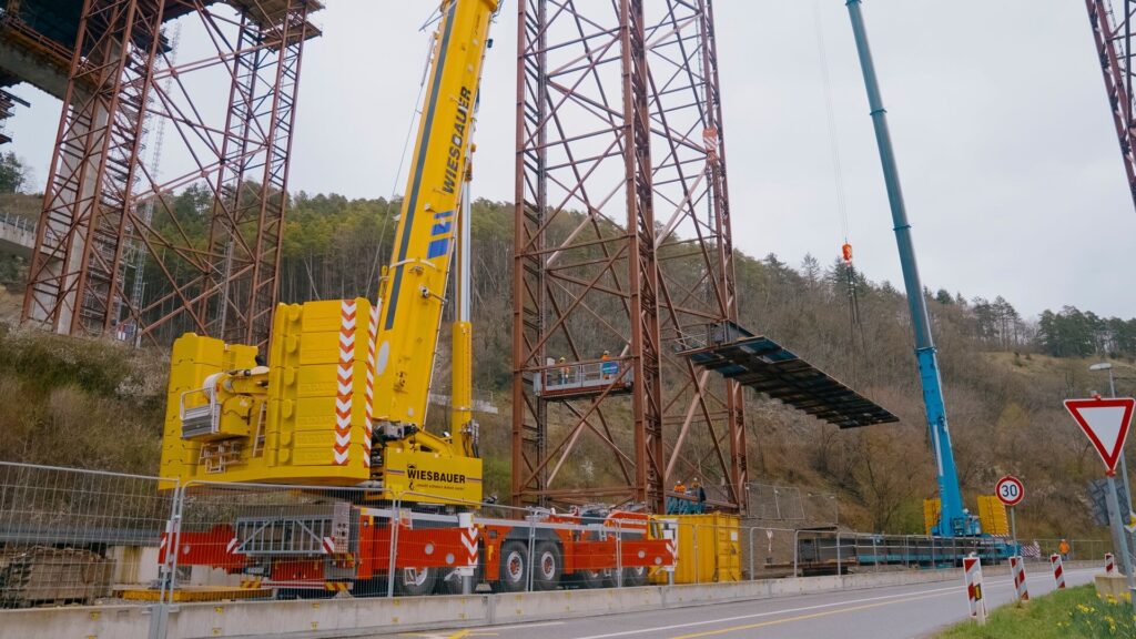 Wiesbauer Tadano AC 7.450-1 all terrain crane lifting a steel bridge element at the Neckartal bridge near Horb