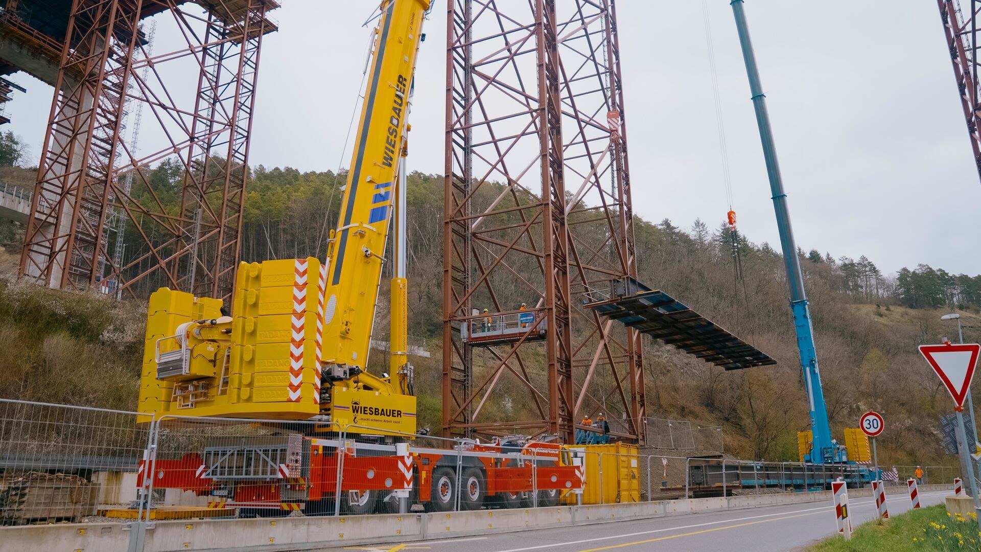Wiesbauer Tadano AC 7.450-1 all terrain crane lifting a steel bridge element at the Neckartal bridge near Horb