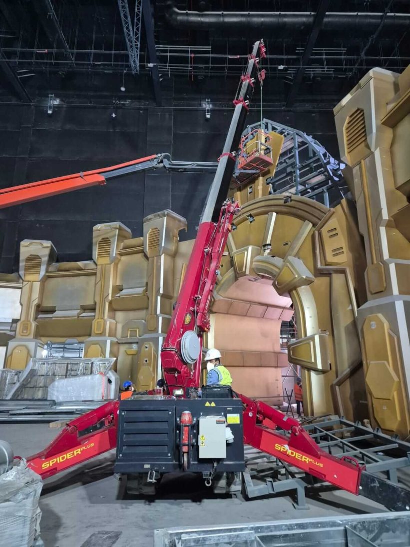 UNIC URW-706 spider crane positioning a GRC panel on the Riyadh project