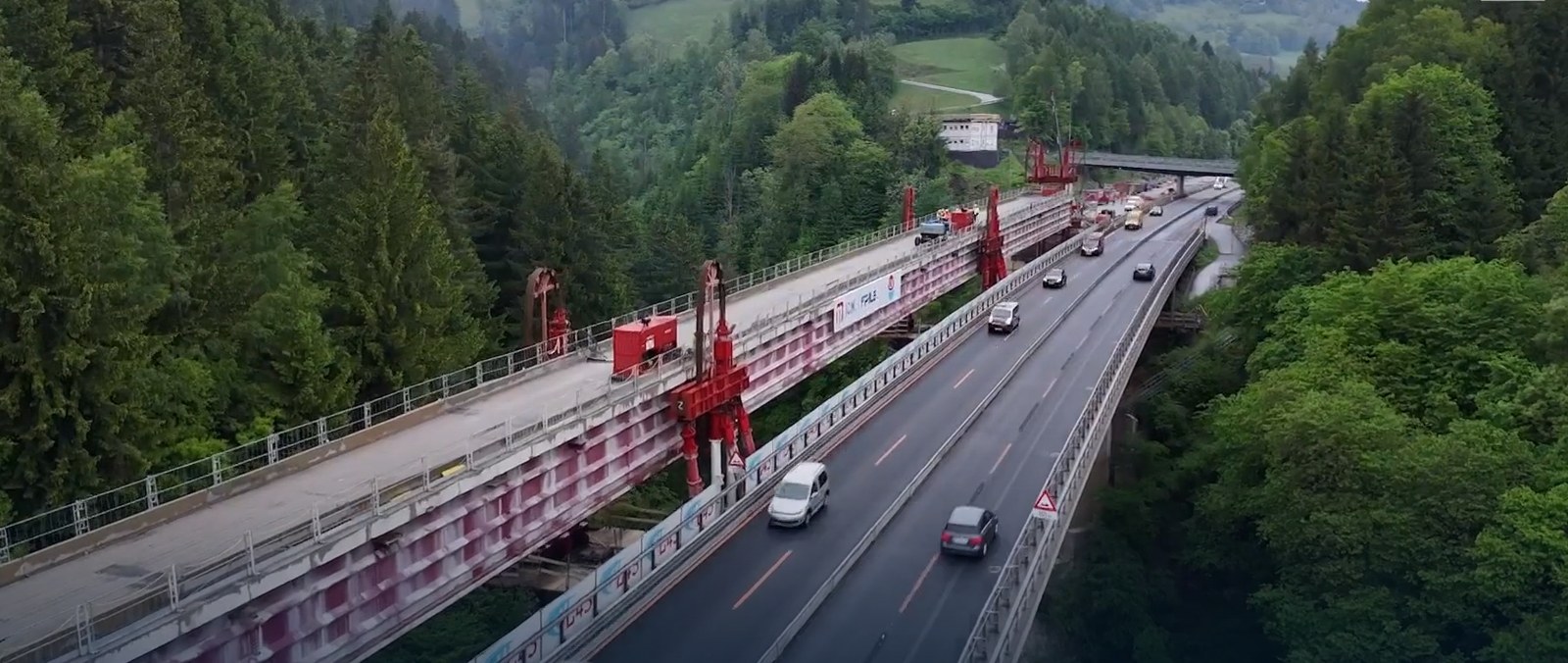 Strand jack portals on the Steinbruckenbach viaduct deck above live traffic on the A10 motorway in Austria