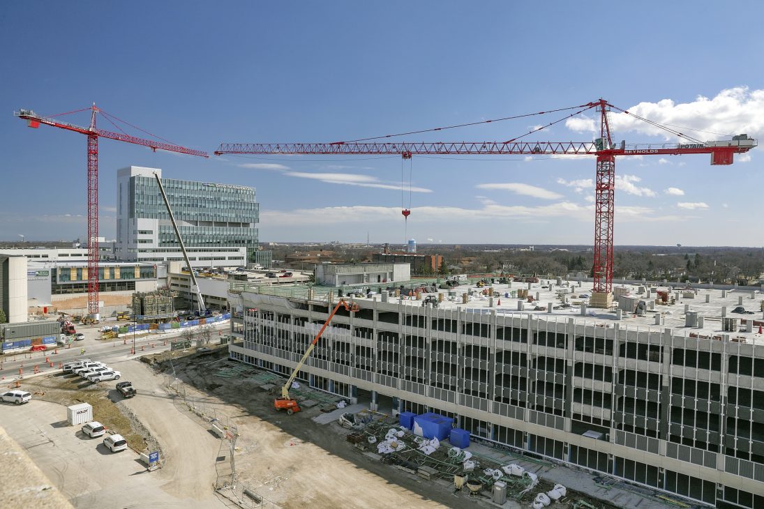 Potain tower crane lifting precast planks on the Froedtert Hospital parking garage in Milwaukee