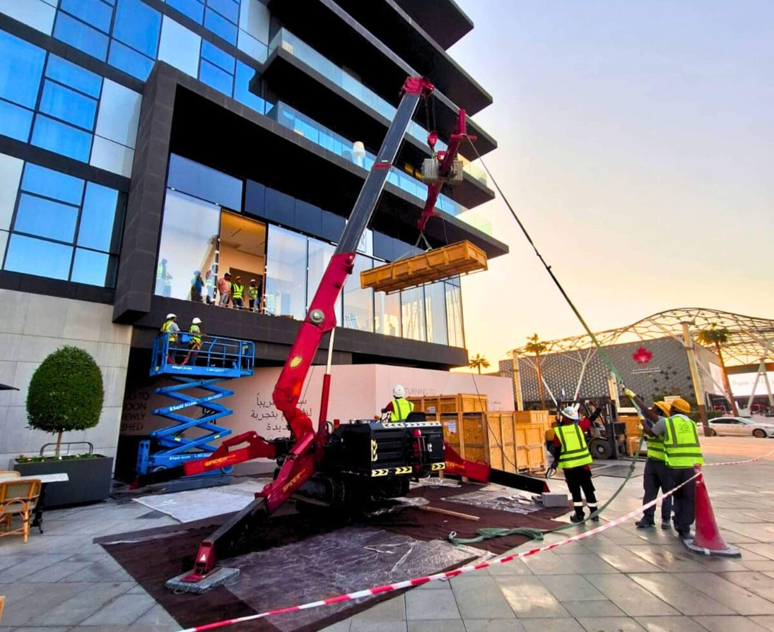 UNIC URW-706 spider crane lifting outside the AGMC Showroom at City Walk in Dubai