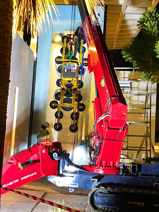 Glass lifter attached to the UNIC URW-706 during the Zayed University panel replacement