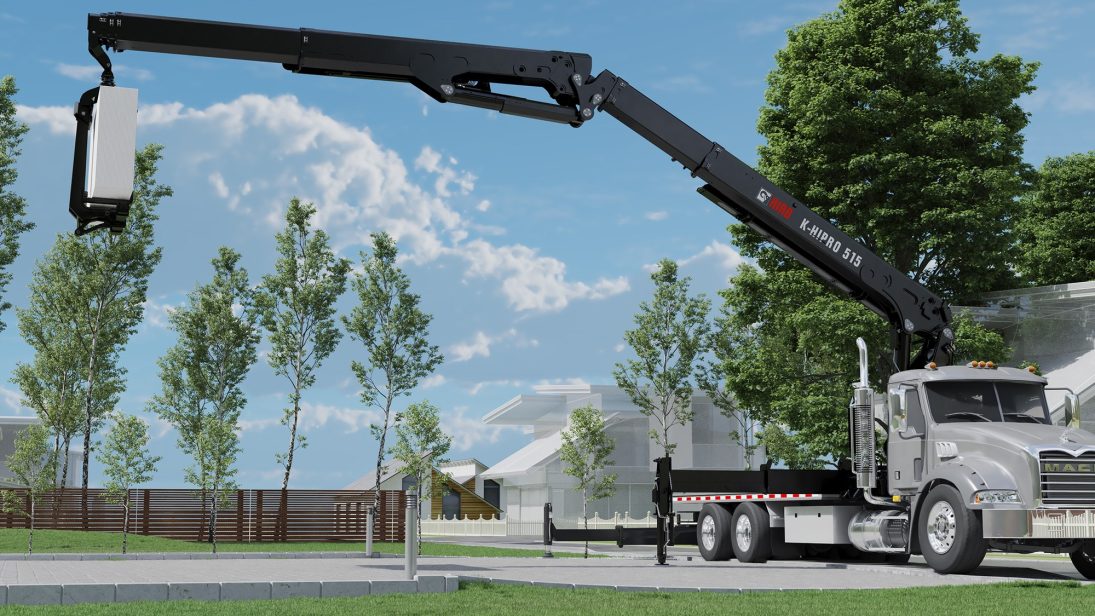 HIAB K-HiPro 515 loader crane on a US truck placing a bundle of building board