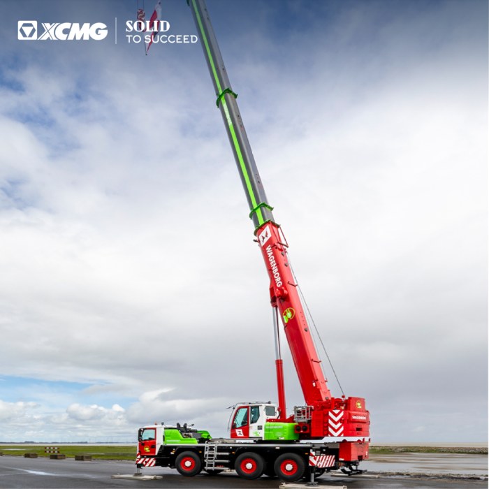XCMG XCA60_EV hybrid all-terrain crane with boom telescoped out on a coastal test area