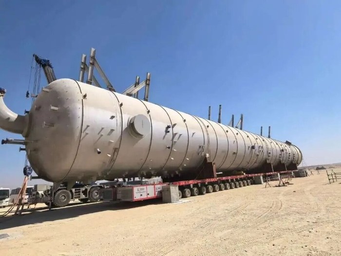 The 1,065-tonne caustic water wash tower on modular transporters before the lift at Jubail, Saudi Arabia