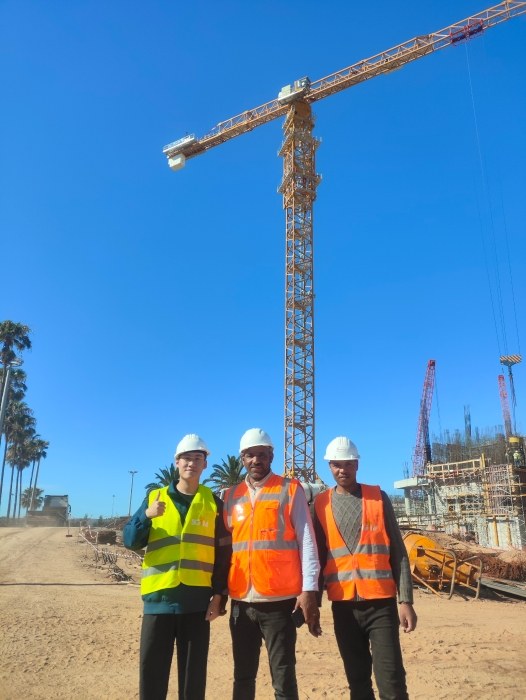 XCMG site team in front of an XGT tower crane at the Moroccan national stadium project