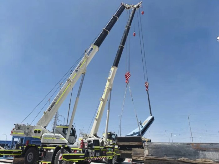Two XCMG wheeled cranes making a tandem lift at the Chuquicamata mine site