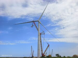 XCMG XGC88000 crawler crane rigged alongside the 26 MW offshore wind turbine it installed in Shandong