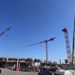 Two Potain MDT389-L16 tower cranes and a Potain MD559 on the Miami administration building site