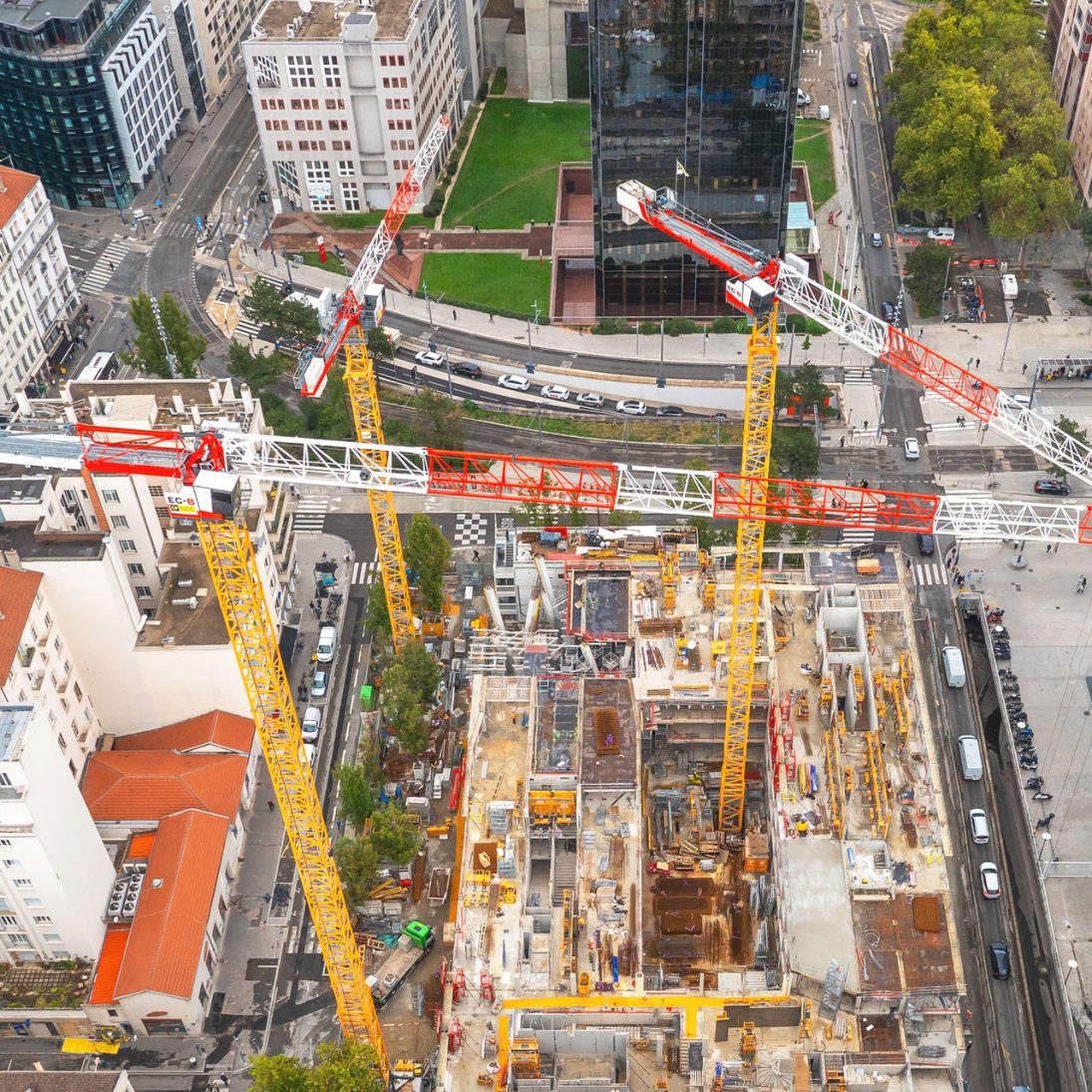 Three Liebherr EC-B flat-top tower cranes building the Ki mixed-use project in Lyon