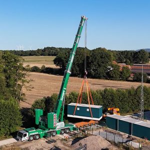 Jandt's new Liebherr LTM 1400-6.1 lifts a 60-tonne transformer station on its first job in Bad Laer. Photo: Liebherr