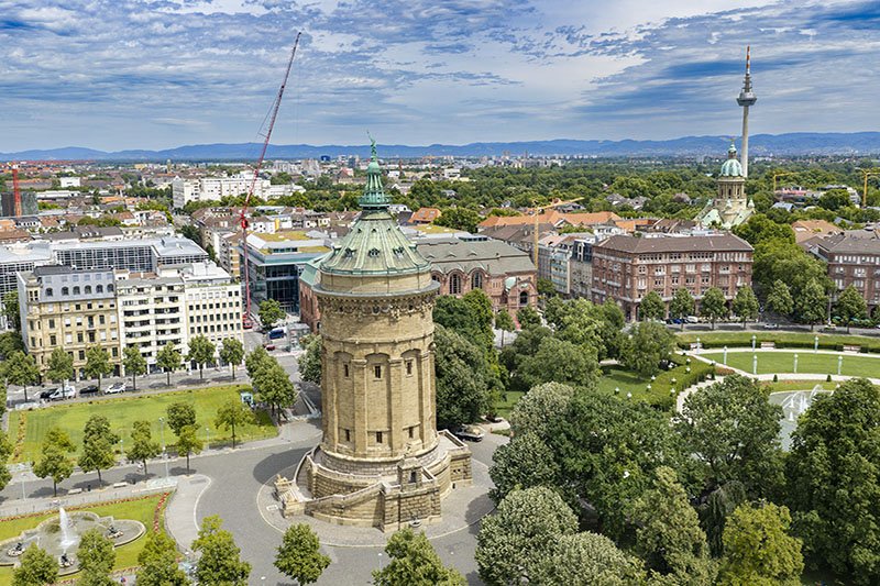 Antenna lift by Liebherr MK 140-5.1 mobile construction crane above the rooftops of Mannheim