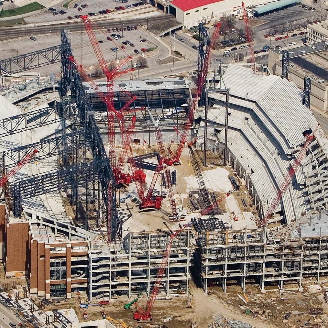 Crawler cranes erect the retractable roof structure of Lucas Oil Stadium in Indianapolis