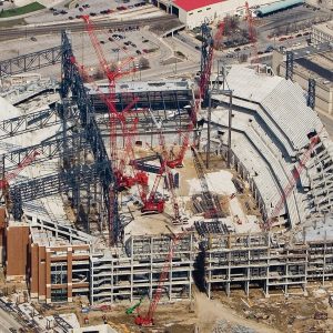 Crawler cranes erect the retractable roof structure of Lucas Oil Stadium in Indianapolis