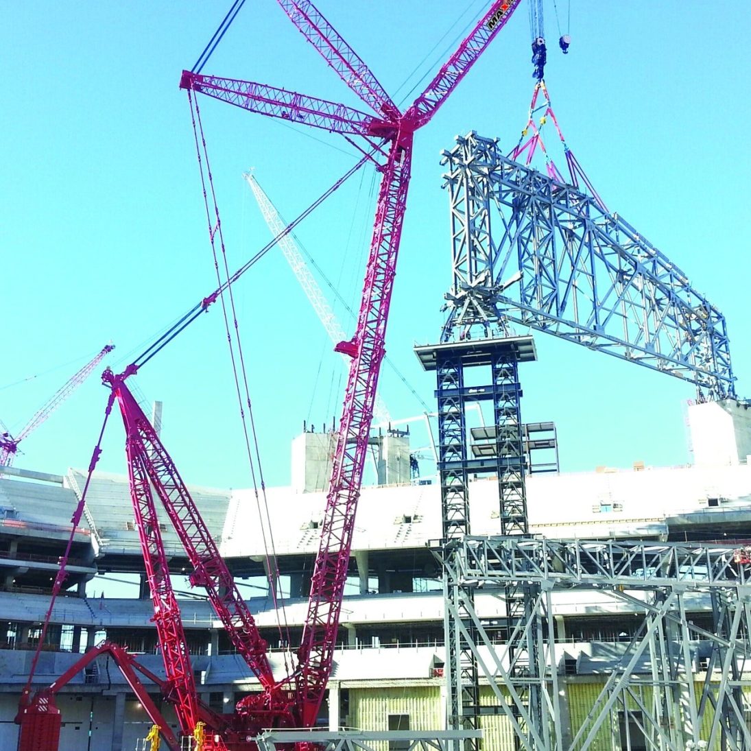 Maxim Crane Works Manitowoc 31000 lifts a roof truss at Mercedes-Benz Stadium in Atlanta