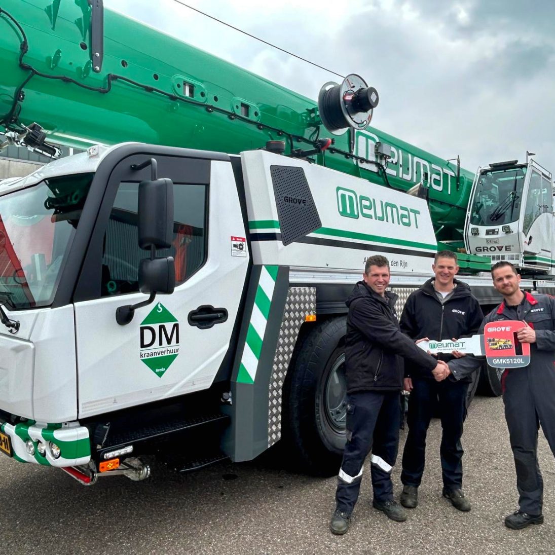 Grove GMK5120L all-terrain crane handover to Meijmat, with Dennis Merks and Rob Lepelaats of Meijmat and Daniel van Beurden of Manitowoc