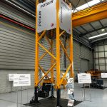 Potain tower crane mast section fitted with anti-intrusion panels on display