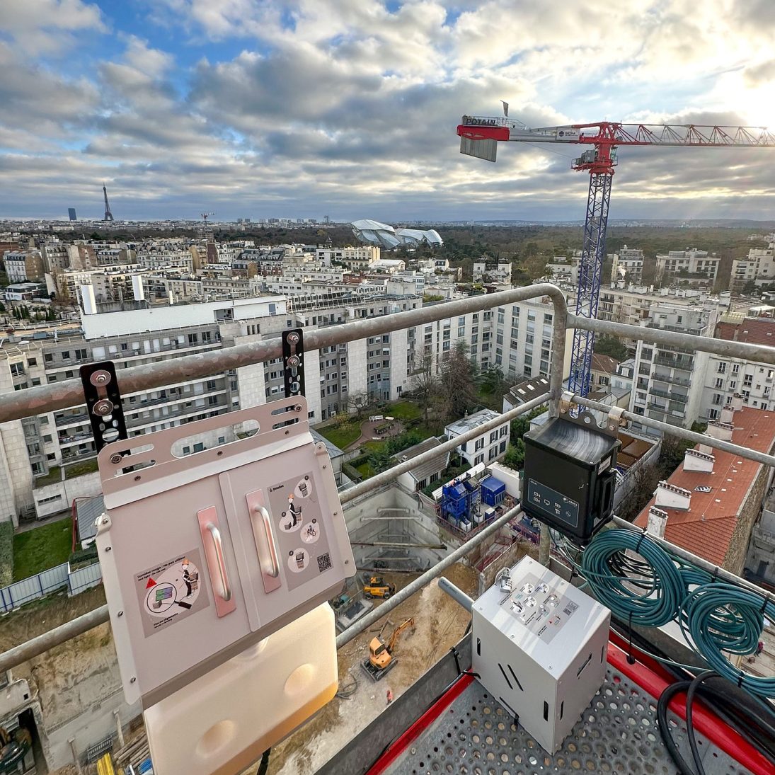 Autonomous operator urinal installed beside a Potain tower crane cab high above Paris
